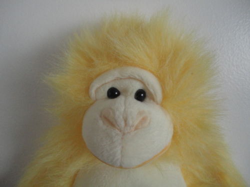 Yellow stuffed store monkey